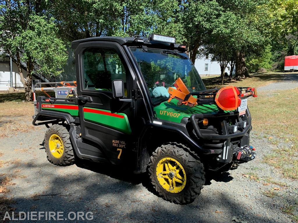 Brush UTV607 is a 2018 John Deere Gator XUV835M Type 7 engine with a 54 hp gasoline engine, seating for 3, heated and air-conditioned cab, a winch that can be used from the front or rear of the vehicle, and four-wheel drive capability.
UTV607 can transport an up to 300-pound patient in a Stokes Basket.
UTV607 is 12&rsquo; 7&rdquo; long, 5&rsquo; 6&rdquo; wide, and 6&rsquo;7&rdquo; tall.
UTV607 is equipped with automotive headlights, tail-lights, brake lights, turn signals, four-way flashers, a car horn, rear view mirrors, and a backup alarm.
A siren, Emergency lights and work lights are installed on the vehicle.  Two forestry rakes and a shovel are routinely carried on the front rack.

